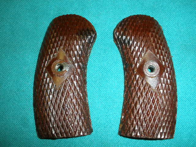 Grip Set NO INSERT (2 Pieces) M1895 Nagant Revolver BAKELITE VG+ Grip Set NO INSERT (2 Pieces) M1895 Nagant Revolver BAKELITE VG+